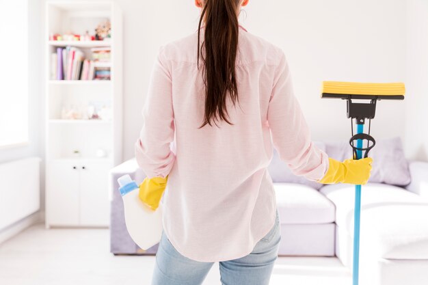 Woman cleaning her home