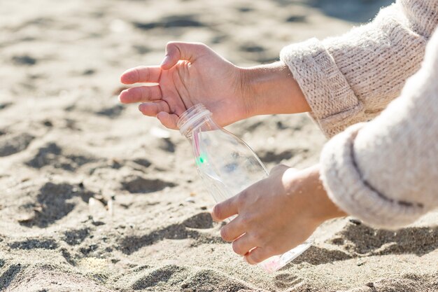 Woman cleaning sand