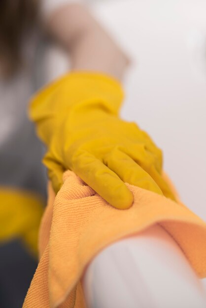 Woman cleaning surface with cloth