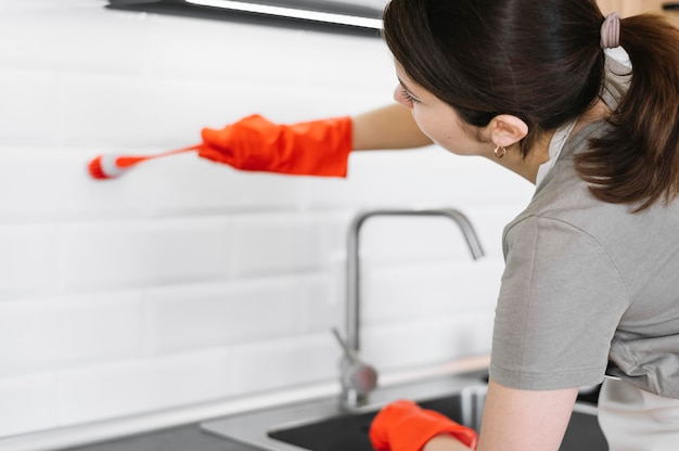 Woman cleaning with brush