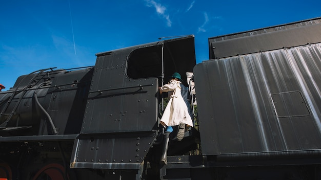 Free photo woman climbing on train