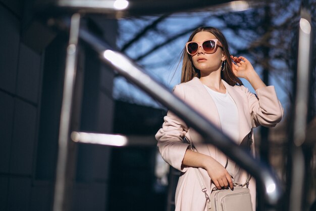 Woman in coat walking in the street