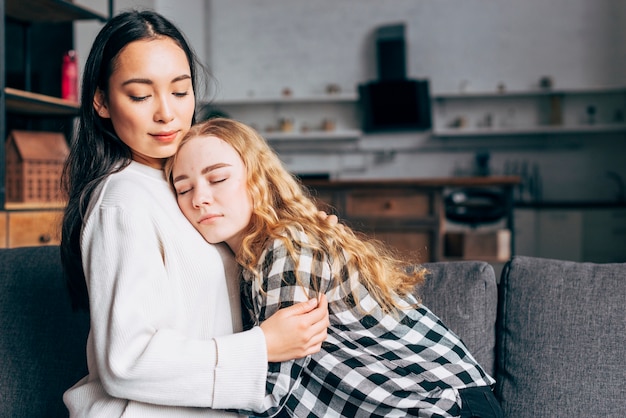 Woman comforting female friend