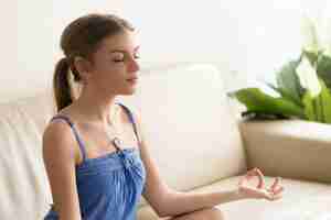 Free photo woman concentrates on positive thoughts in morning