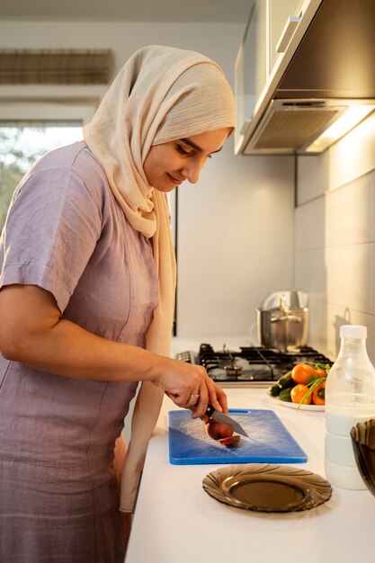 woman cooking at home side view