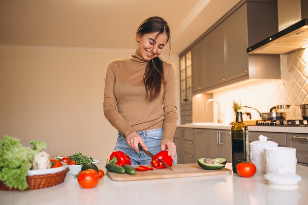 Woman cooking at kitchen