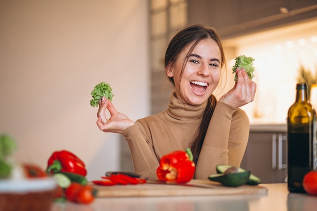 Woman cooking at kitchen