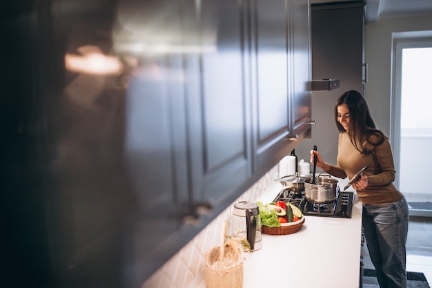 Woman cooking at kitchen