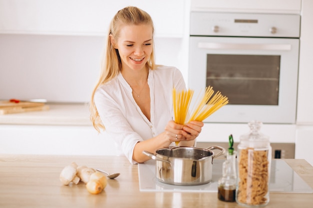 Woman cooking at the kitchen