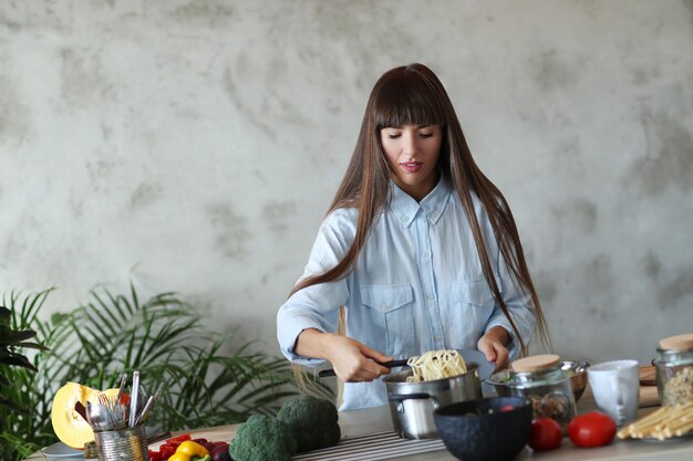 Woman cooking at the kitchen