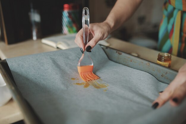 Woman cooking pizza at kitchen