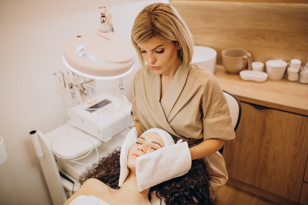 Woman at cosmetologist making beauty procedures