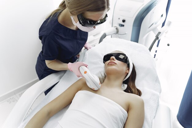 Woman in cosmetology studio on laser hair removal