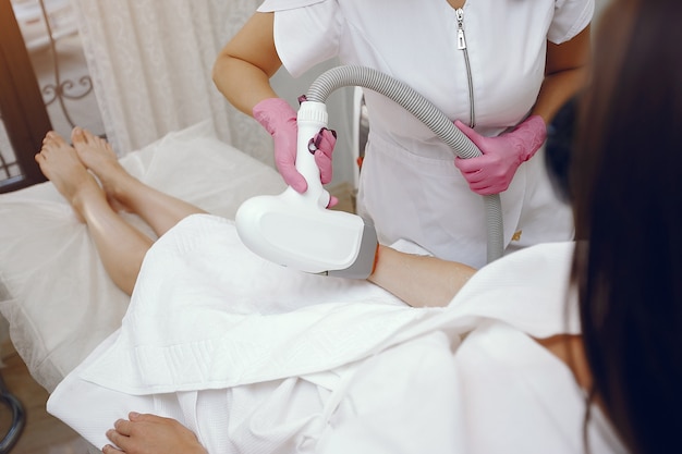 Woman in cosmetology studio on laser hair removal
