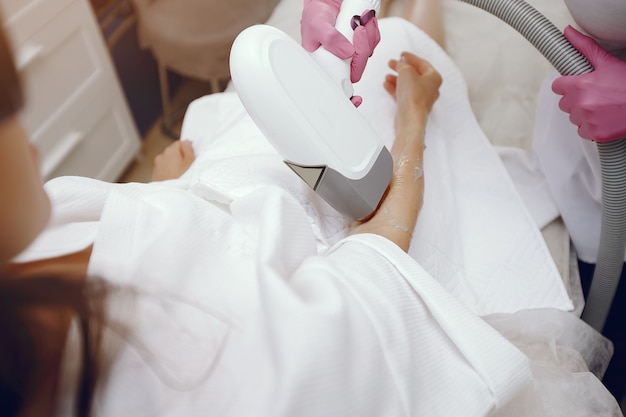 woman in cosmetology studio on laser hair removal