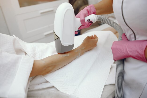 woman in cosmetology studio on laser hair removal