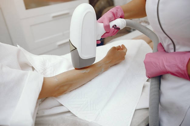 Woman in cosmetology studio on laser hair removal