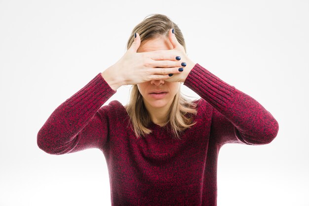 Woman covering eyes