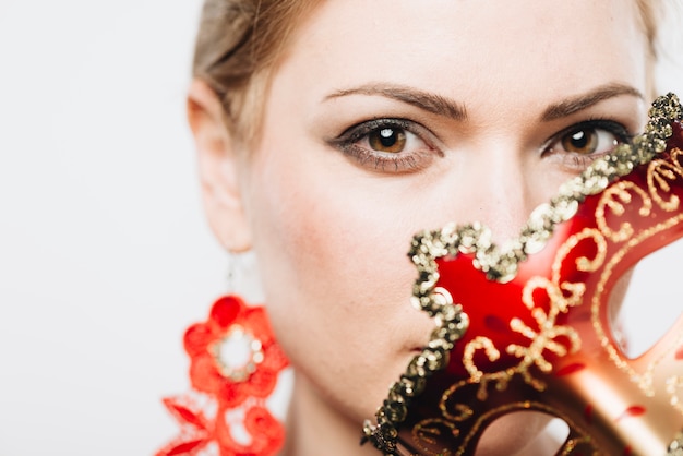 Free photo woman covering face with bright mask