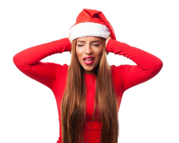 Woman covering her ears with santa's hat