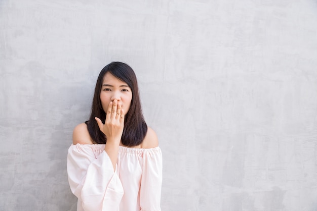 Free photo woman covering her mouth