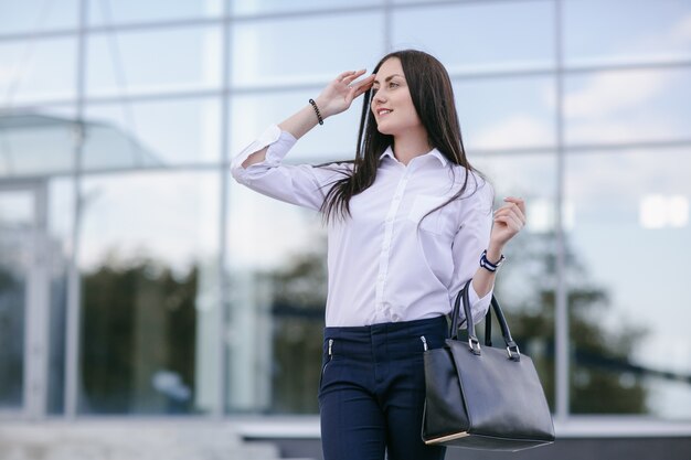 Woman covering the sun with one hand