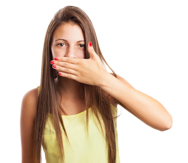 Woman coverting her mouth with her hand