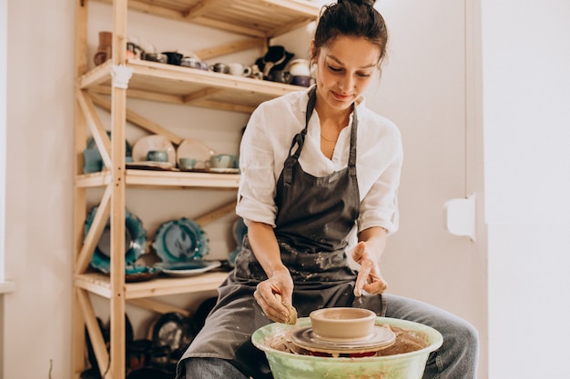 Woman craftmaster at a pottery shop