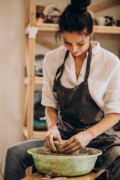 Woman craftmaster at a pottery shop