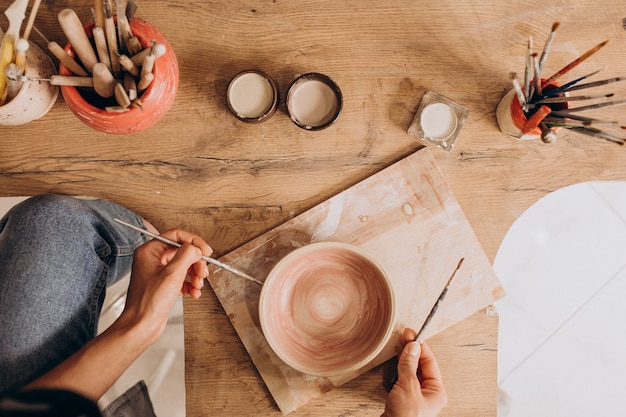 Woman craftmaster at a pottery shop