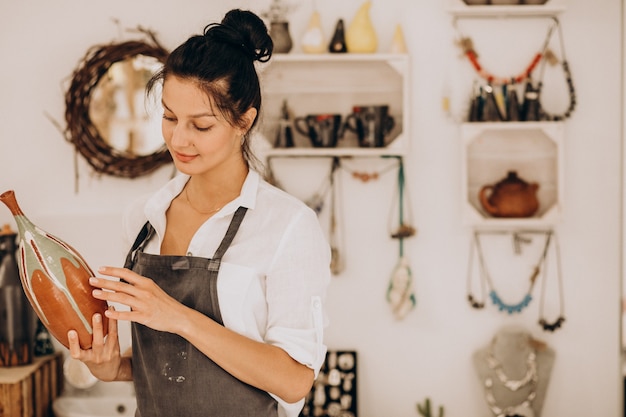 Woman craftmaster at a pottery shop