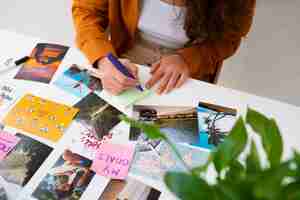 Free photo woman creating inspiring vision board high angle