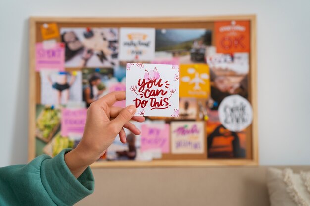 Woman creating inspiring vision board side view