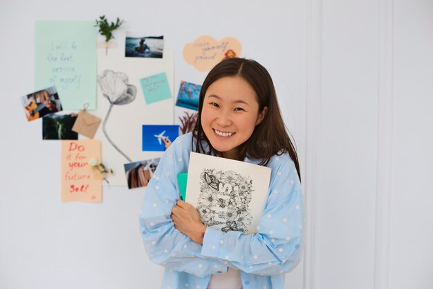 Woman creating their own vision board