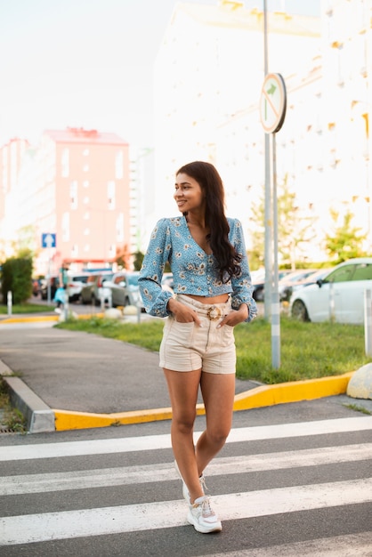 Woman on crosswalk looking away