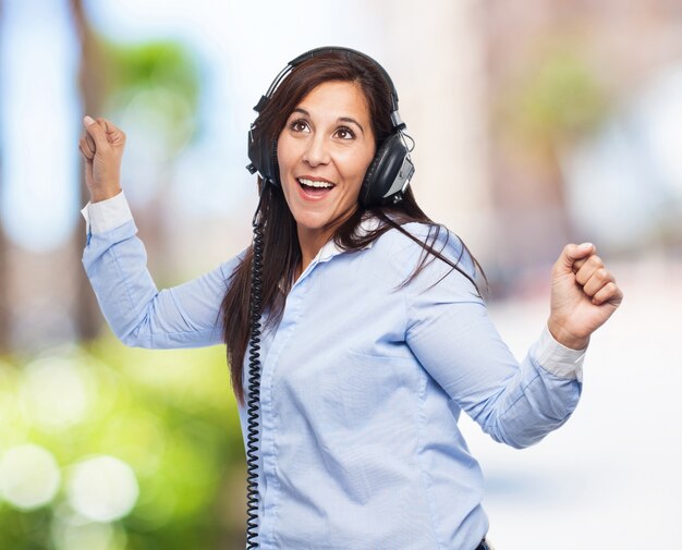 woman dancing with headphones