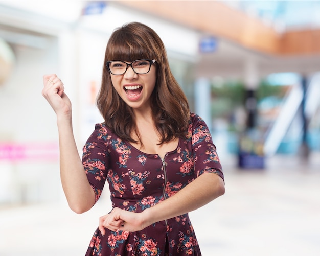 Woman dancing with her mouth open