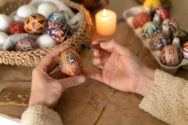 Woman decorating easter eggs