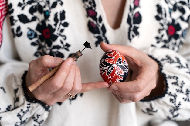 Woman decorating easter eggs