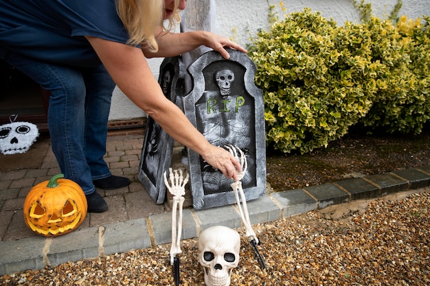 Woman decorating her home for halloween