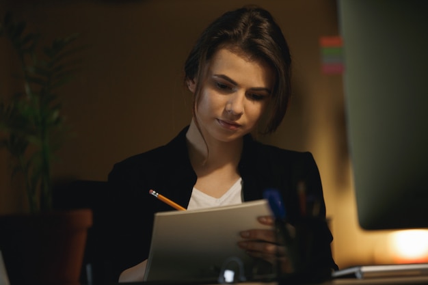 Woman designer drawing in office