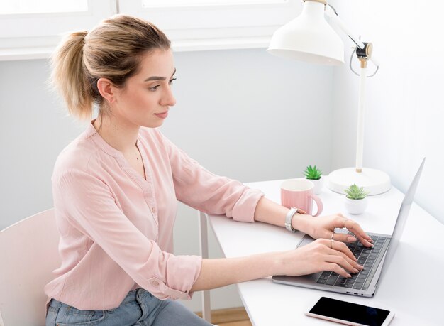 Woman at desk working from home
