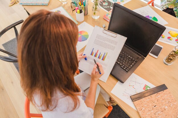 Woman at desktop exploring diagrams