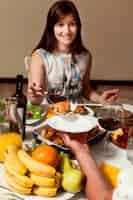 Free photo woman at dinner table