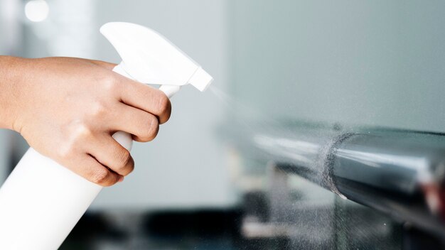 Woman disinfecting the railings during coronavirus outbreak