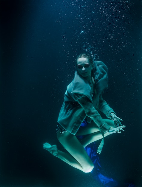 Woman diving under the water