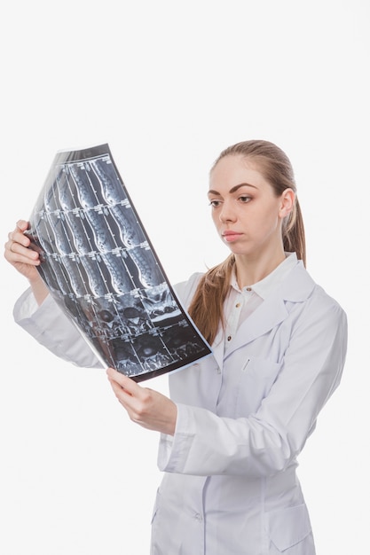 Woman doctor looking at x-ray shot