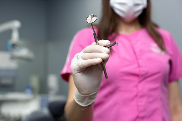 Woman doctor showing medicine tools