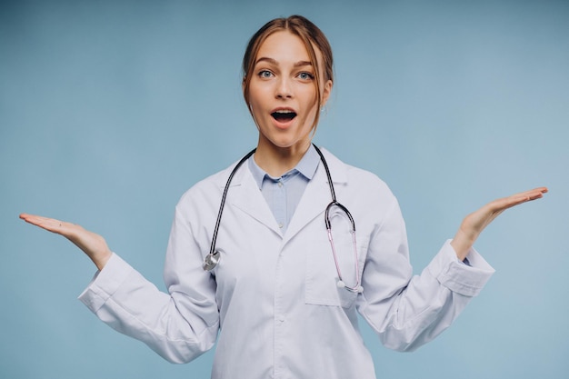 Free photo woman doctor wearing lab coat with stethoscope isolated