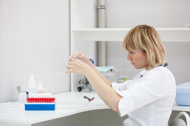 Woman doctor with test tube